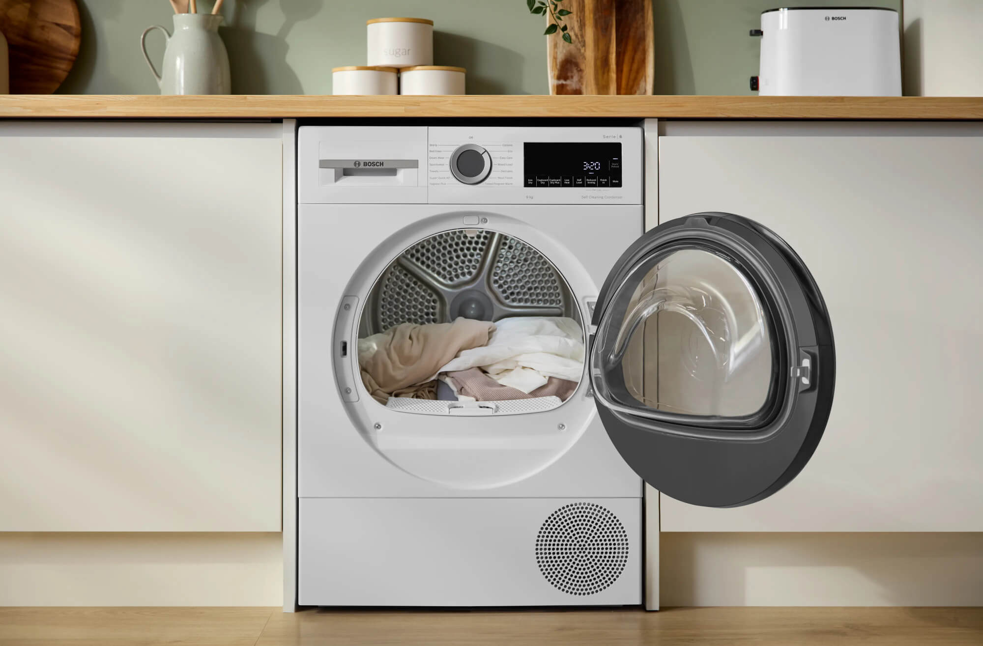 Tumble dryer next to a washing machine